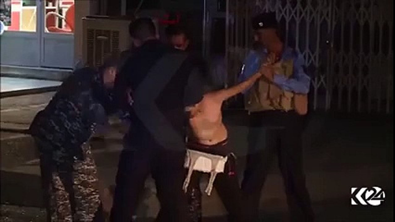 ISIS child bomber in Kirkuk is held by Kurdish security forces as they remove the explosive belt