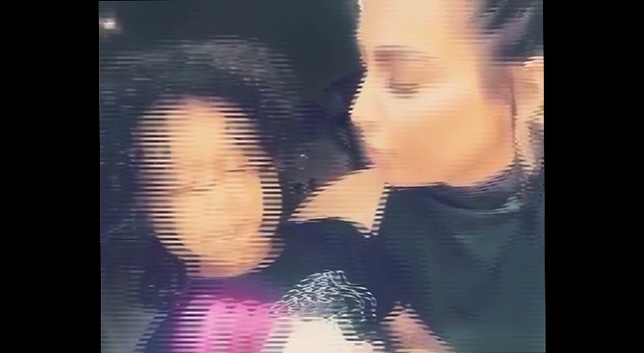 Gimme kiss! Kim Kardashian as the pair play with her Minnie Mouse doll