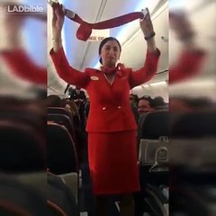 Football fans on flight distracting the air hostess doing the safety announcement