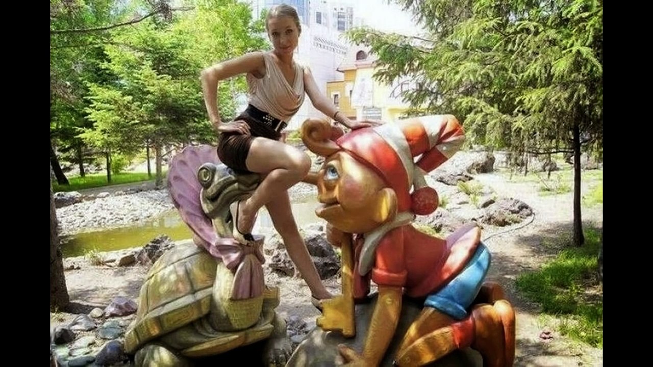 Girls having Fun with Statues
