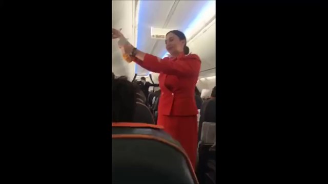 Football fans on flight distracting the air hostess