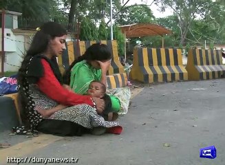 Two sisters protest outside Governor House for stopping them to get education .