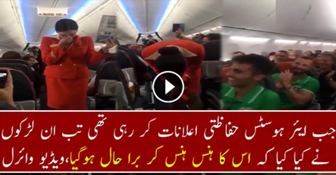 Football fans on flight distracting the air hostess doing the safety announcement