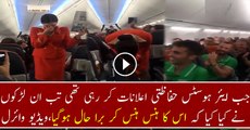 Football fans on flight distracting the air hostess doing the safety announcement