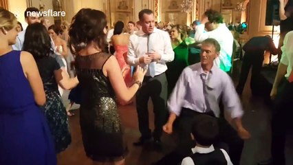 Man dances too enthusiastically at wedding, falls over
