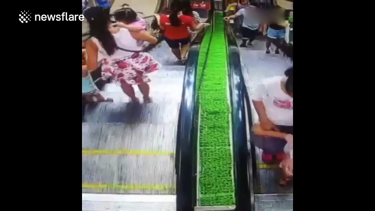 Baby in buggy rolls down escalator
