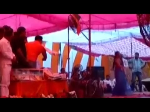 BJP leader seen showering currency notes on dancer