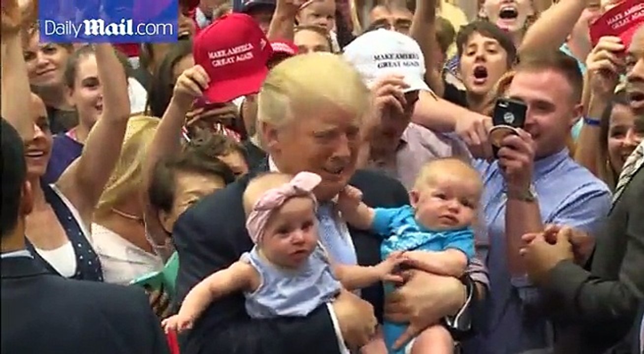 Baby bursts out in tears in Trump's arms at Colorado rally