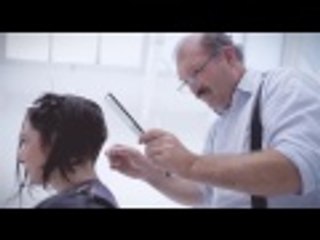 Woman long to short haircut