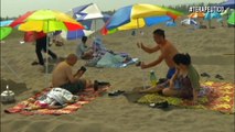 Arena caliente para curar enfermedades, la popular terapia en una playa china