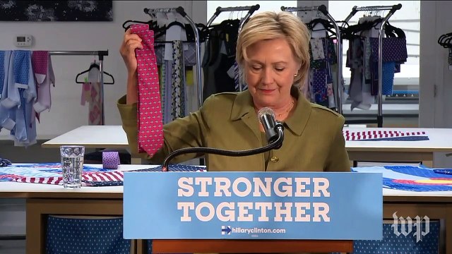 Clinton blasts Trump for making ties overseas