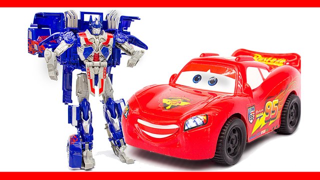 Мультфильм про трансформеров. Оптимус Прайм спасает Молнию Маккуин от злого десептикона. Машинки