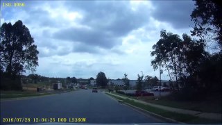 7-28-2016-D  Sedan driving into oncoming lane at intersection.