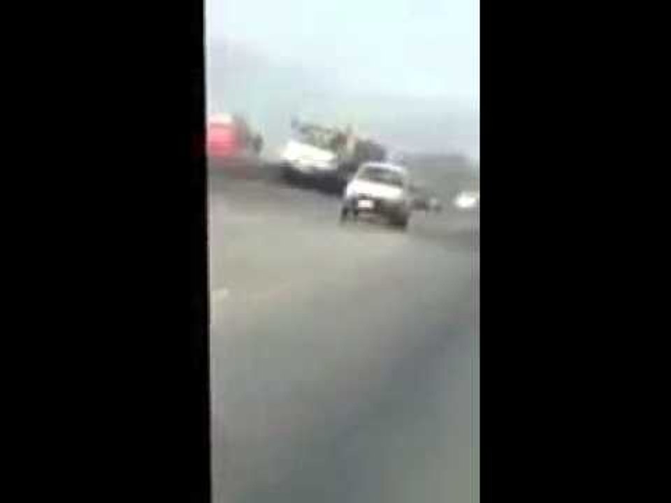 Brave car driver controls and stops 22 wheeler trailer with failed brakes on motorway in pakistan