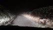 Snowfall drive down a country lane
