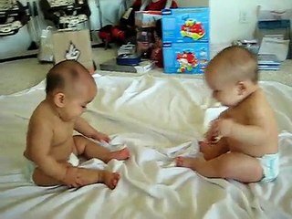 Twin baby boys have a conversation
