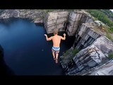 Daredevils Show the Camera How to Dive From Cliffs Into Water