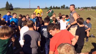 Pinconning football coach Dave LeVasseur runs team bonding exercise