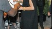 Rihanna looks high spirits clutches glass white wine flaunting legs oversized jumper dress Poland