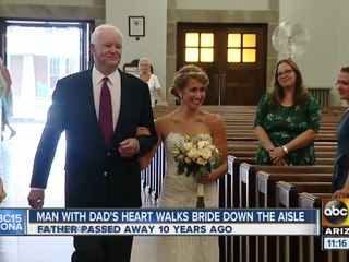 A woman was able to have the recipient of her dad's heart walk her down the aisle