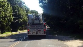 Ladder truck driving main road to return to station