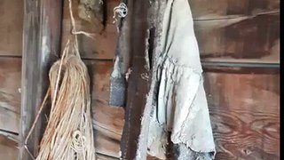 Clothes still hanging next to a old entrance to a crumbling farmhouse. South Alberta canada