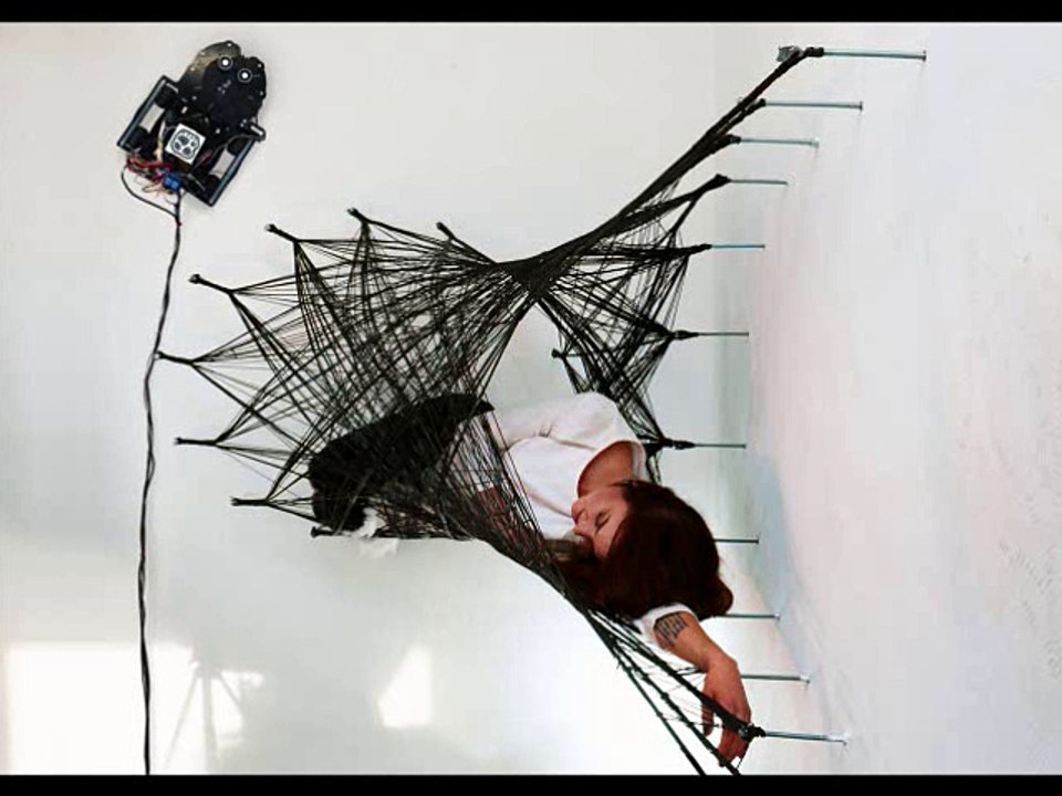 Wall-riding robots spin carbon fiber structures