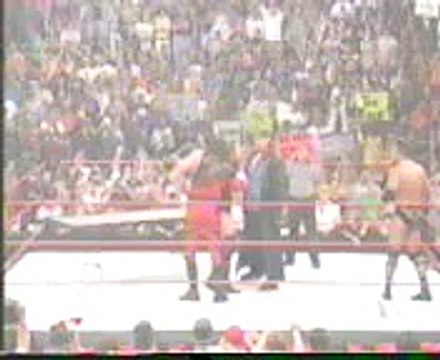 WWE - Undertaker and Kane BOTH chokeslam HHH through a table