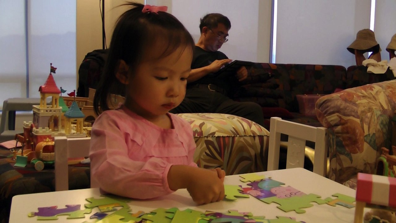 Girl Playing Peppa Pig Puzzle