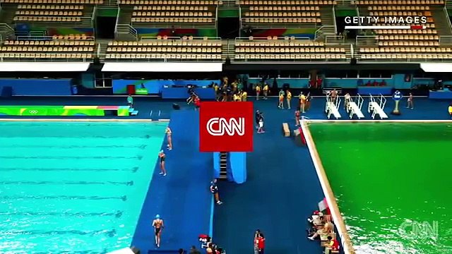 Olympic diving well turns green