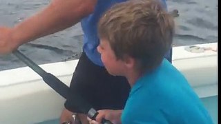 7 year old reels in angry King Mackerel.