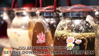 Ornamented glass teapots with healing herbal tea, traditional medicine practice. Stock Footage