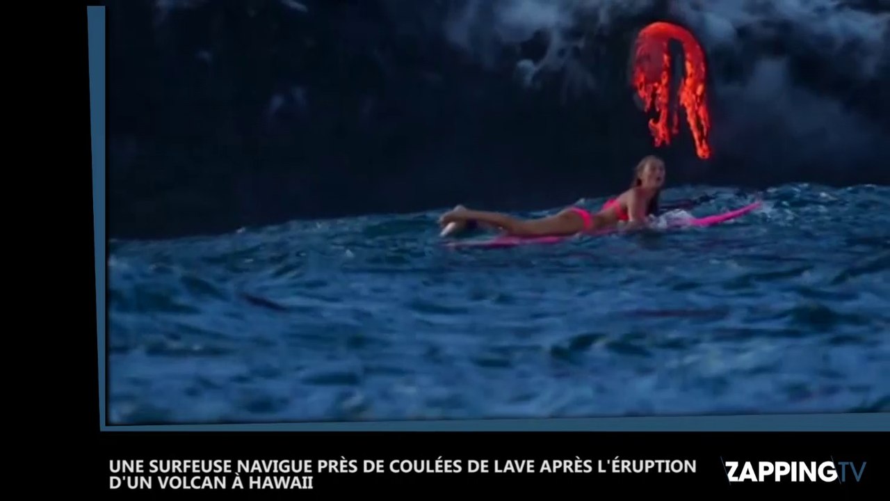 Une surfeuse navigue près de coulées de lave après l’éruption d’un volcan à Hawai