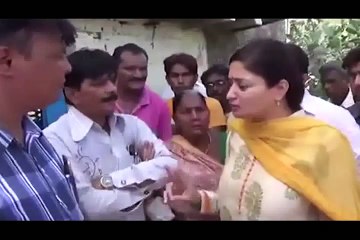 Indian MP called Poonam Madam falls into a SEWER while giving a TV interview