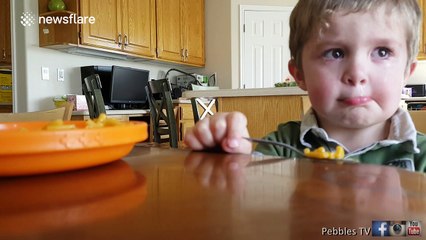 Little boy really doesn't want to eat his vegetables
