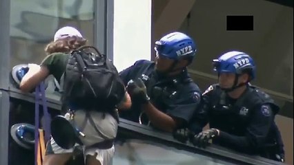 Police capture man climbing Trump Tower