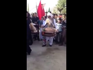 A Punjabi girl dancing on Dhol in wedding barat.