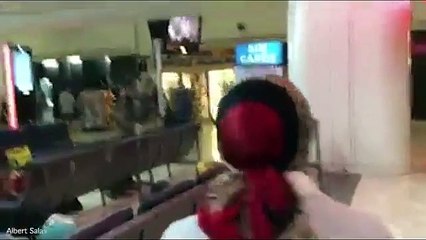 Panic at JFK Airport as police tell civilians to 'get down'