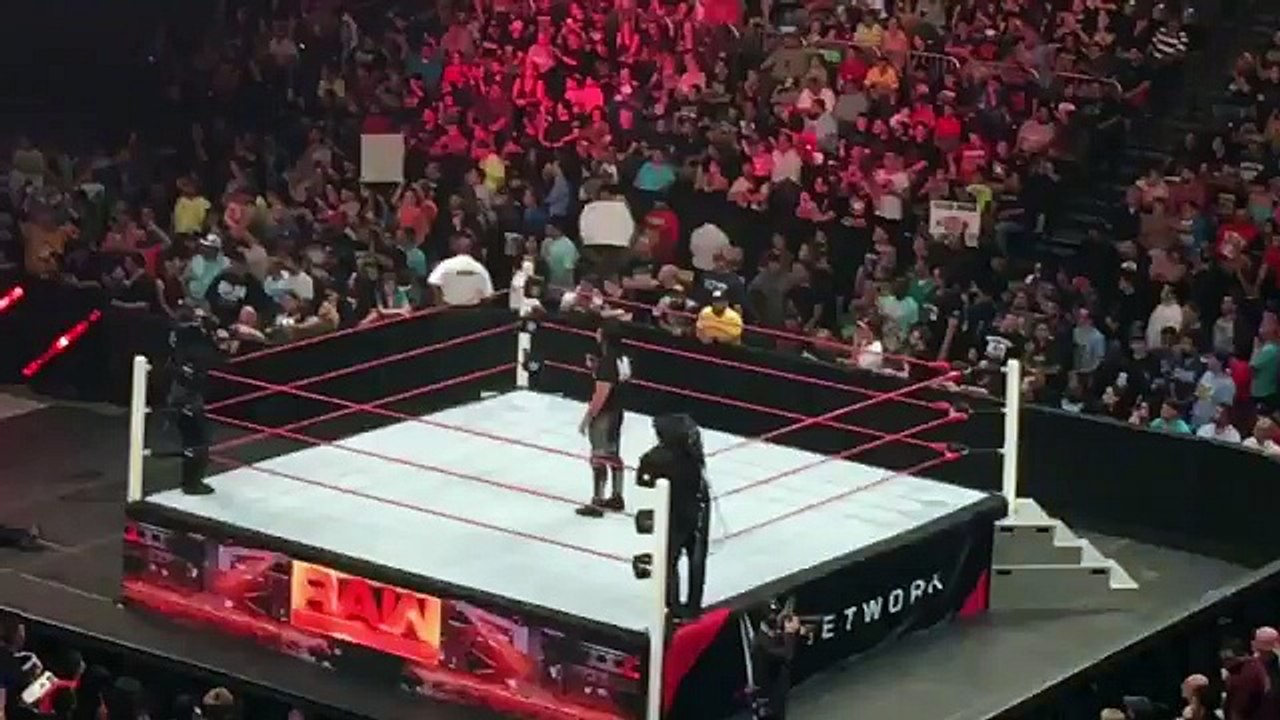 Fan run in on Seth Rollins