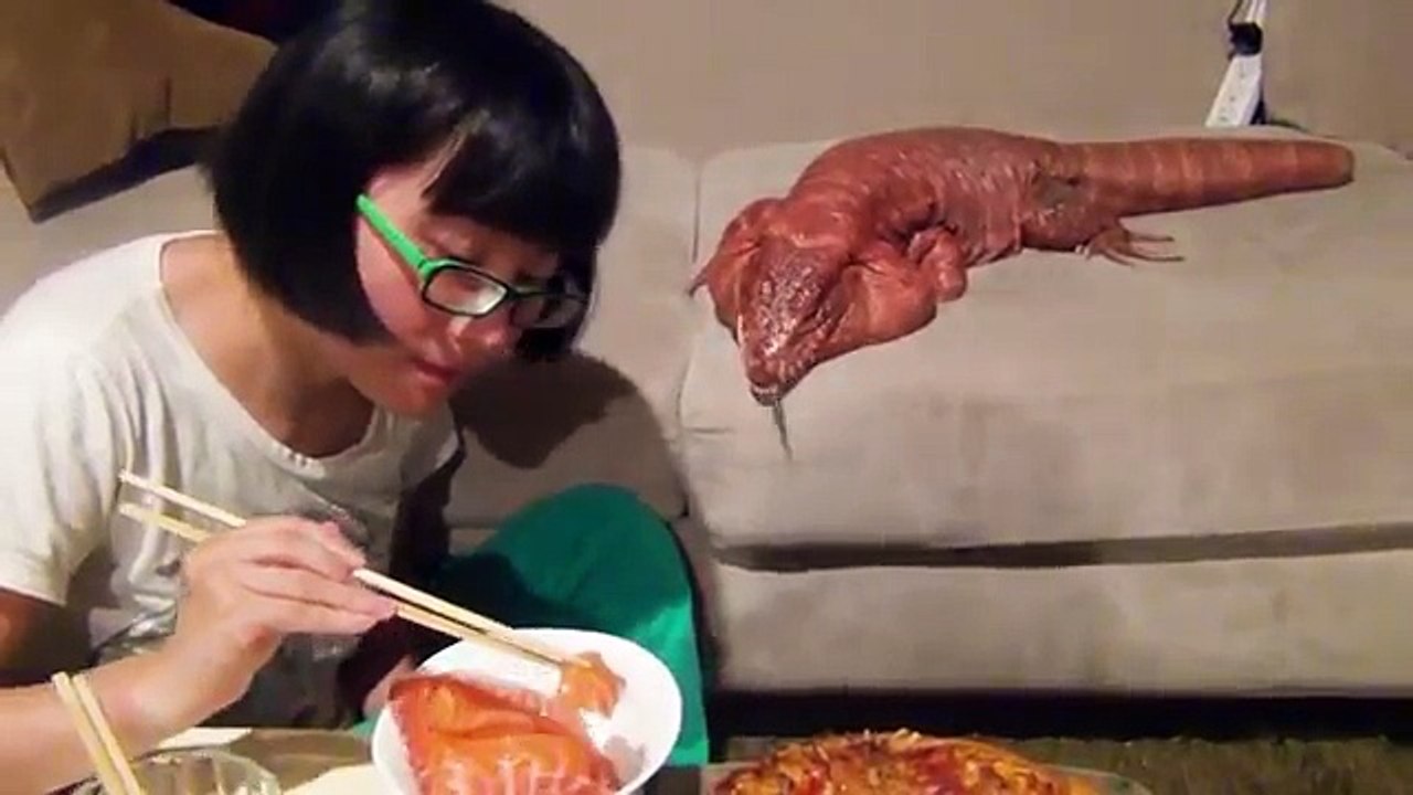 Girl Feeding Most horrible Lizard