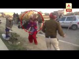 Police men beating a girl  who allegedly molested by a truck driver