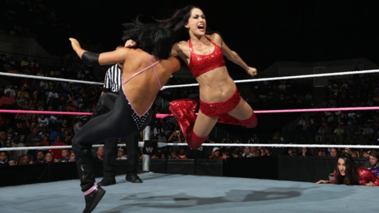 AJ Lee Vs Brie Bella ( AJ Lee dressed as Nikki Bella )