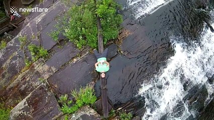Man takes selfie on a waterfall with a drone