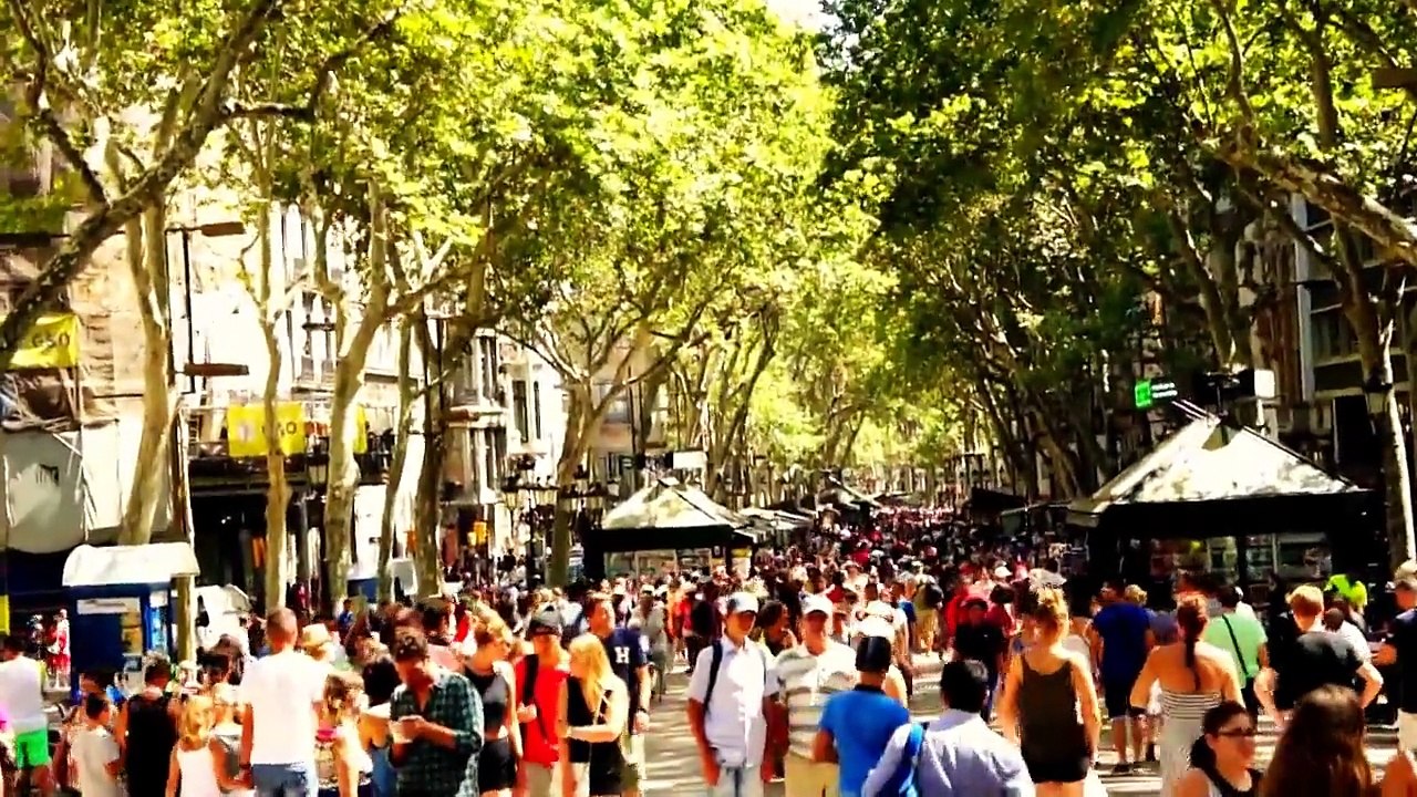 Tourists in Las Ramblas of Barcelona