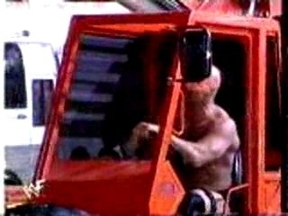 austin drops hhh in a car from a crane
