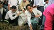 Suu Kyi takes out the trash