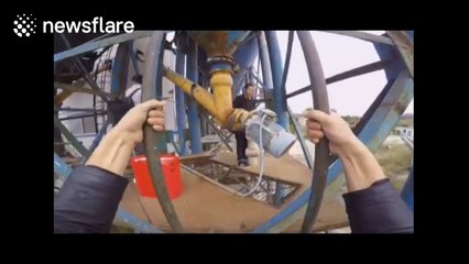Chinese man performs balancing tricks in construction site