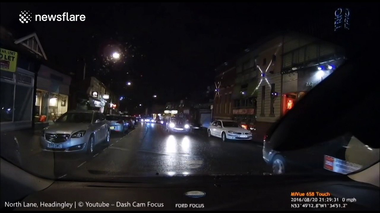 Man crosses street to close to car and gets foo...