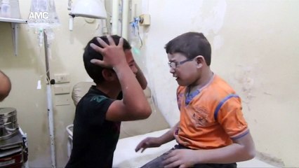 Young boys grieve brother killed in Aleppo bomb blast