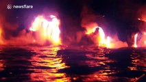 Amazing footage of massive lava flow hitting the ocean